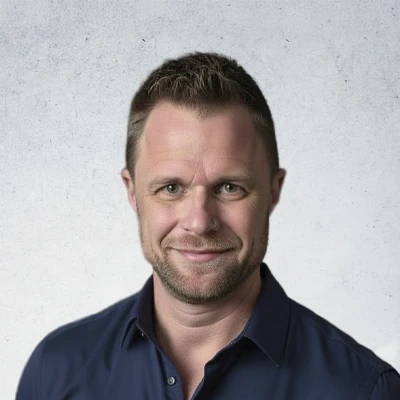 A headshot of Adam Cole, a massage therapist at Kindred Family Chiropractic + Wellness.